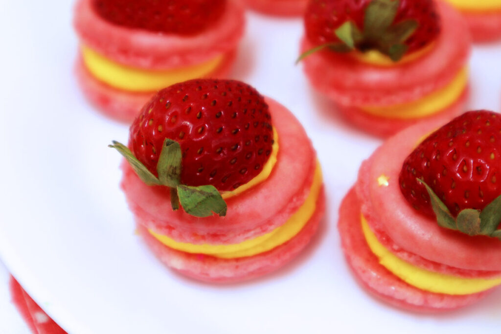 Real strawberries on macarons