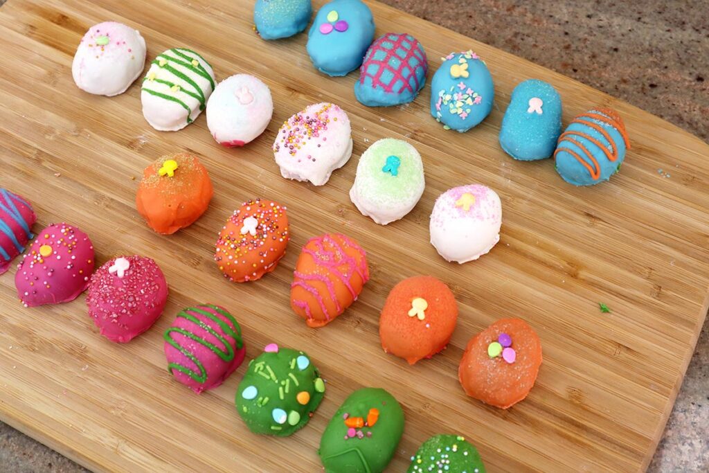 Colored Easter Egg Cake Bites in a Row on a Platter