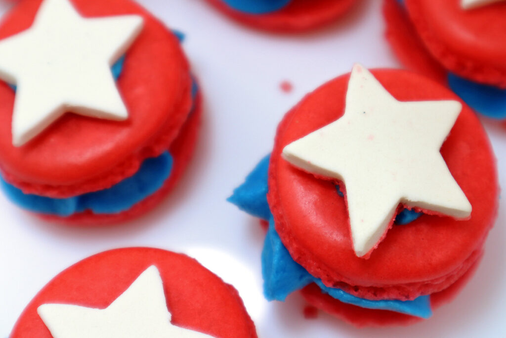 White Sugar Icing Stars on Red Macarons